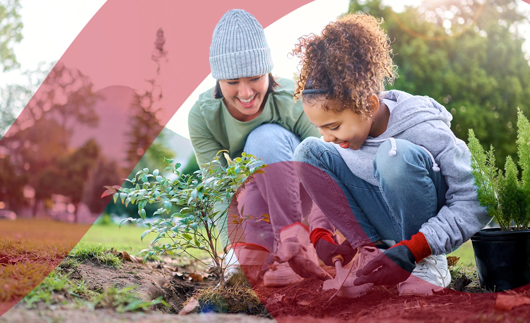 A mum and daughter enjoying gardening together